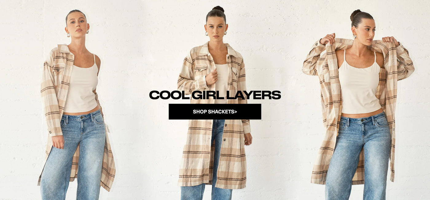 Woman wearing a plaid shacket with text promoting 'Cool Girl Layers' and 'Shop Shackets'.