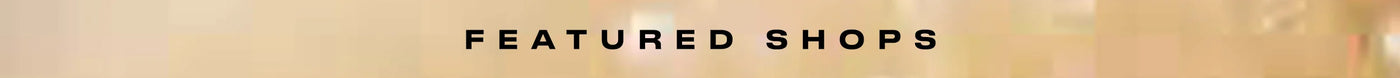 Text 'FEATURED SHOPS' in a bold, sans-serif font on a white background